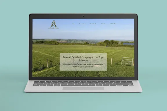 Arkadia Farm website home page on laptop